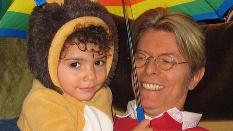 David Bowie holds young Lexi Jones