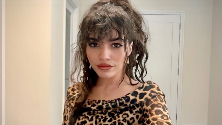 Lexi Jones takes selfie in animal-print shirt