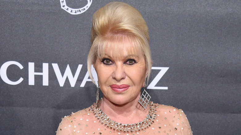 Ivana Trump posing at jewelry event wearing a pale pink dress