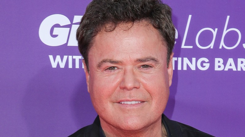 Donny Osmond posing for cameras