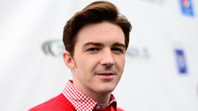 Drake Bell looking at camera