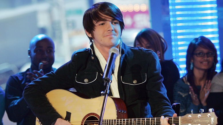 Drake Bell playing guitar 