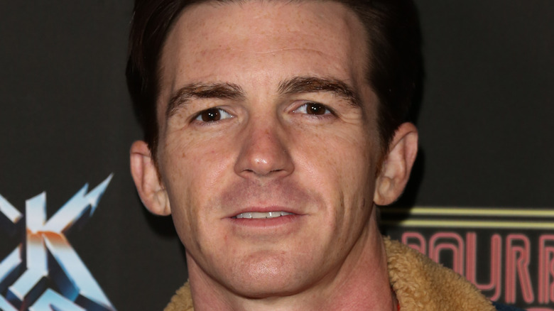 Drake Bell looking at camera