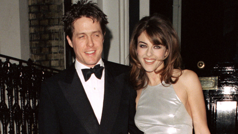 Elizabeth Hurley, Hugh Grant smiling 90s