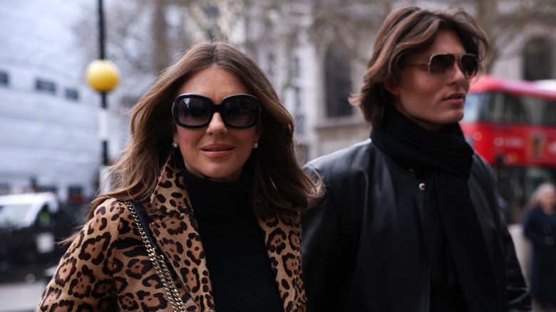 Damian and Elizabeth Hurley leaving court.