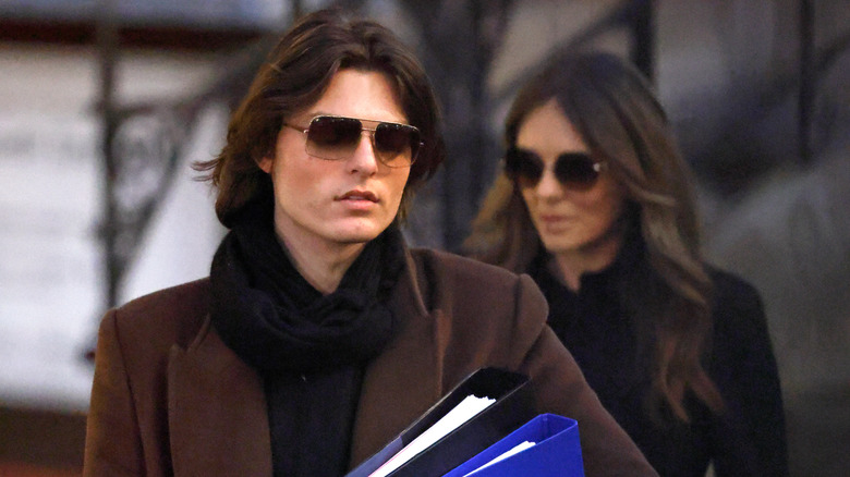Damian Hurley walks ahead of his mother outside court.
