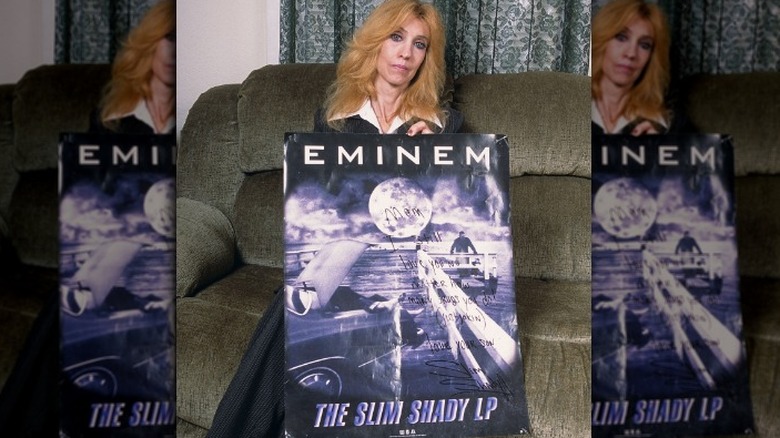 eminem's mom debbie holding slim shady poster
