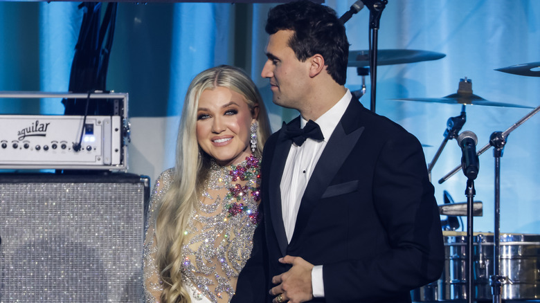 Charlie Kirk and Erika Kirk embracing