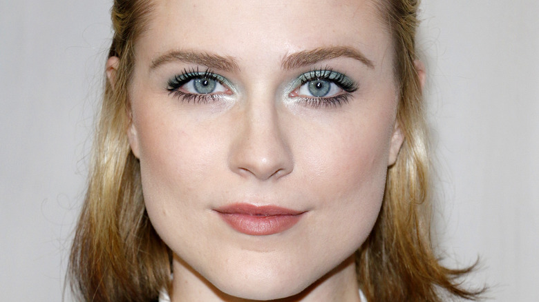 Evan Rachel Wood with short hair in a half ponytail and blue eyeshadow