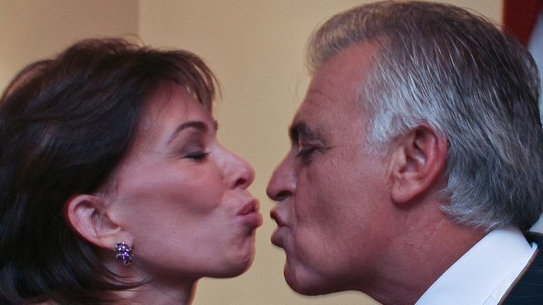 Jeanine and Albert Pirro leaning in for a kiss