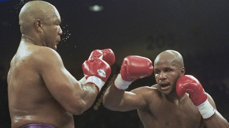 George Foreman and Michael Moorer in a boxing match