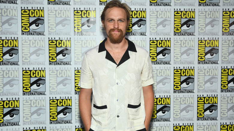 Wyatt Russell in a white shirt