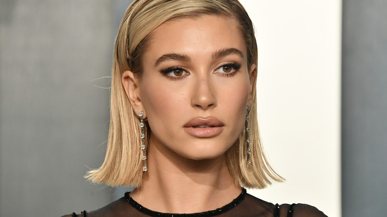 Hailey Bieber posing at event