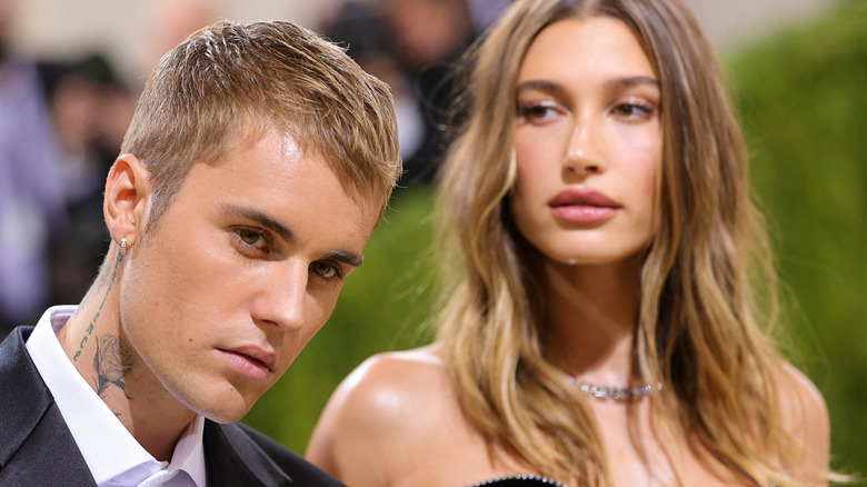 Hailey Bieber behind Justin Bieber