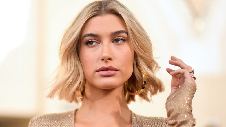 Hailey Bieber large gold earrings