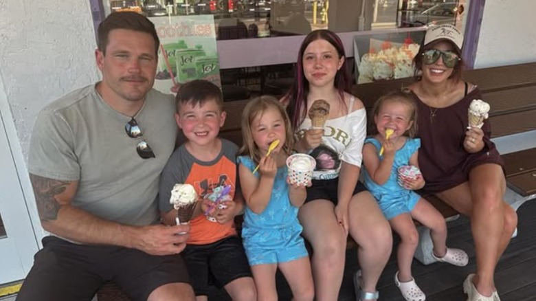 Cole and Chelsea DeBoer pose with their kids.
