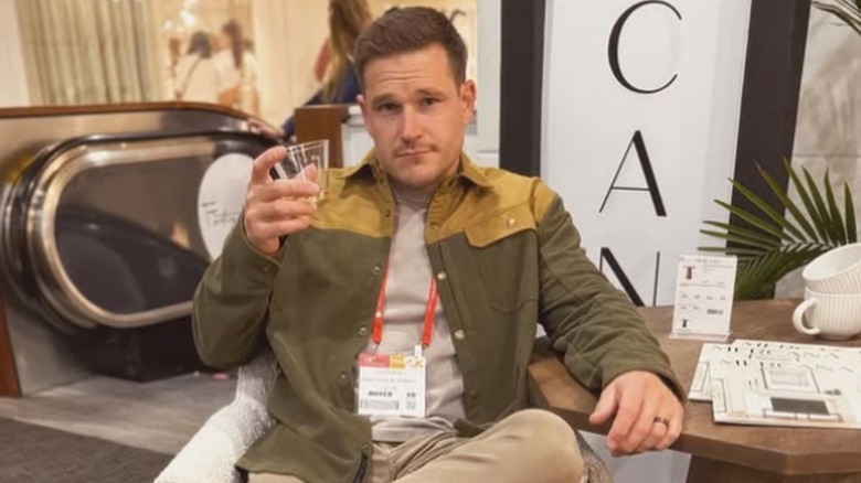 Cole DeBoer posing with a drink.