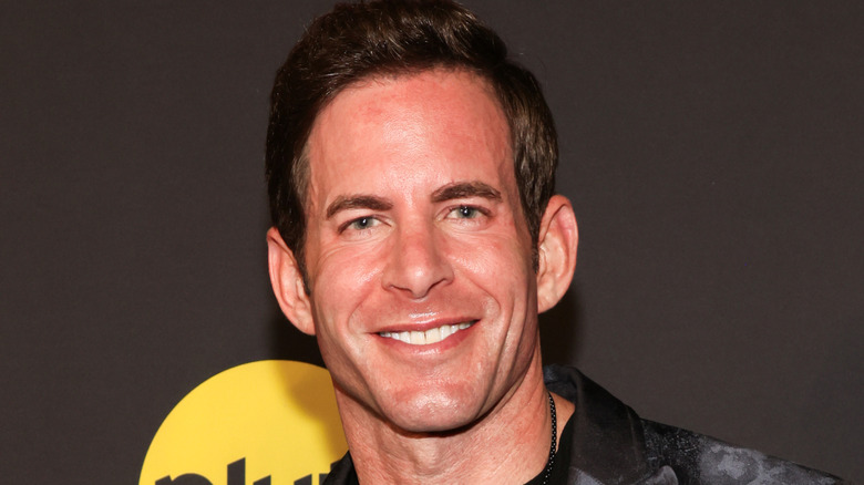 Tarek El Moussa smiling on 2024 red carpet