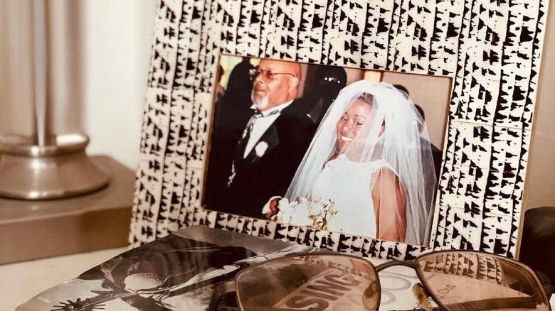 Picture of a framed photo of Tiffany Brooks and her father on her wedding day