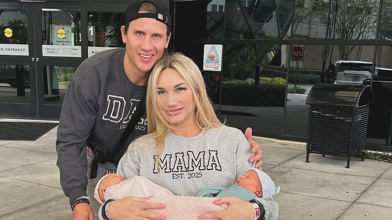 Brooke Hogan poses with Steven Oleksy and their newborn twins