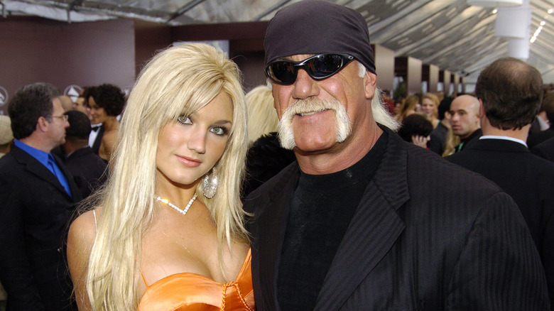 Brooke Hogan and Hulk Hogan posing together at red carpet event