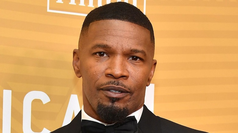 Jamie Foxx walking a 2020 red carpet