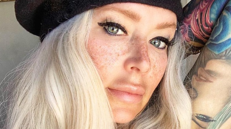 Jenna Jameson looks at camera in selfie