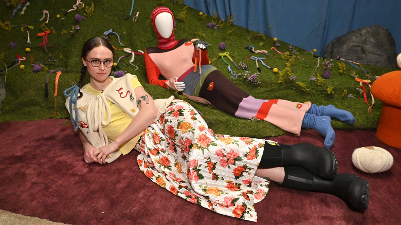 Ella Emhoff lies next to mannequin at NYFW in 2023