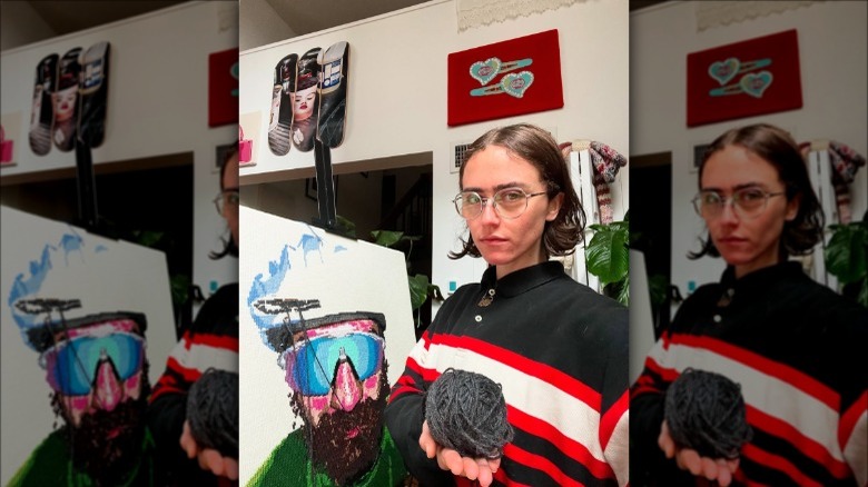 Ella Emhoff poses with her knitted art