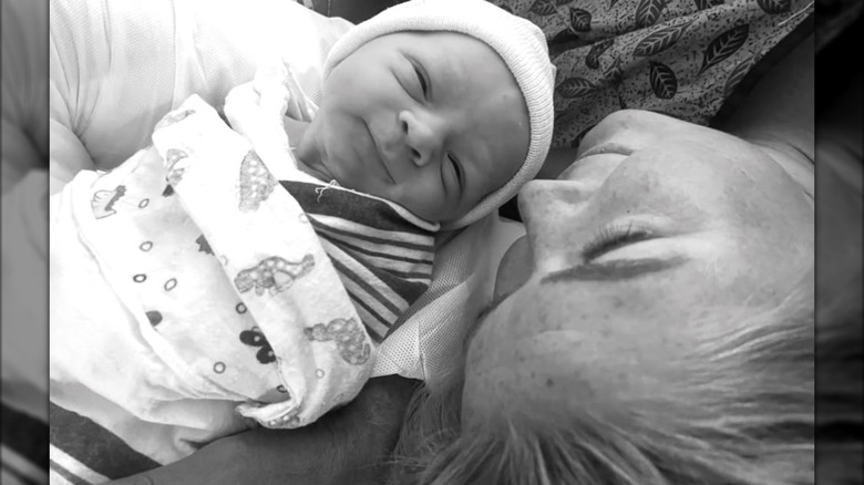 Karoline Leavitt cuddling her new born baby