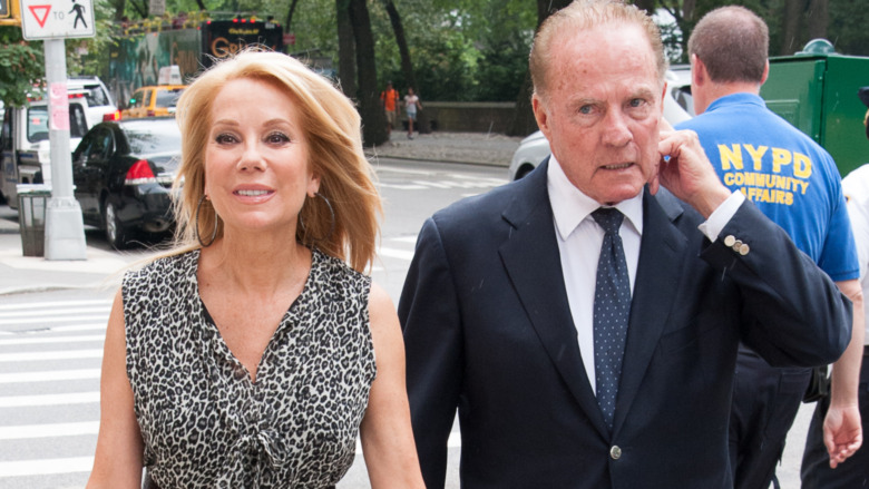 Frank Gifford and Kathie Lee Gifford walking apart
