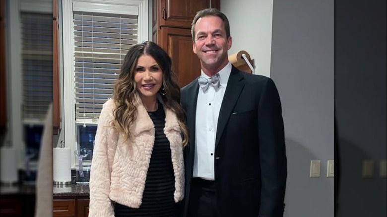 Bryon Noem posing with Kristi Noem in a kitchen.