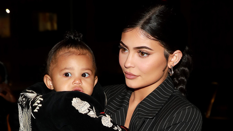 Kylie Jenner and her daughter, Stormi, walking