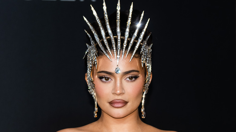 Kylie Jenner at an event with a headdress
