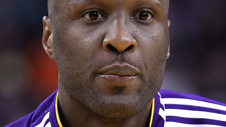 Lamar Odom wearing a Lakers warm up jacket