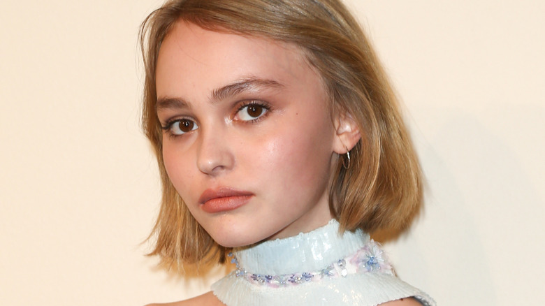 Lily-Rose Depp posing in scarf matching top