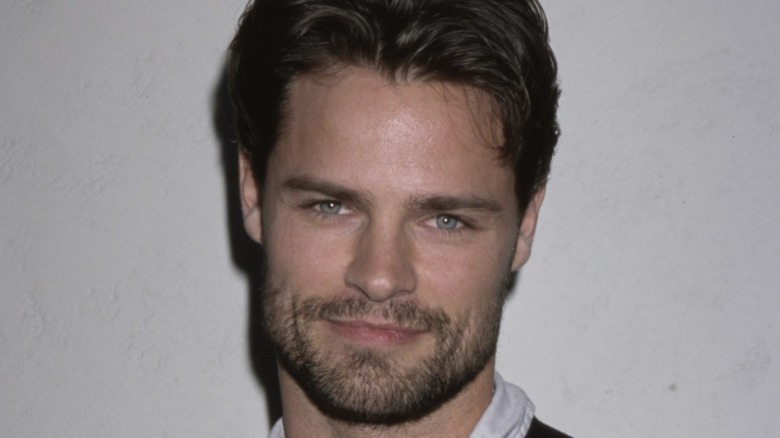 Dylan Neal closed mouth smile