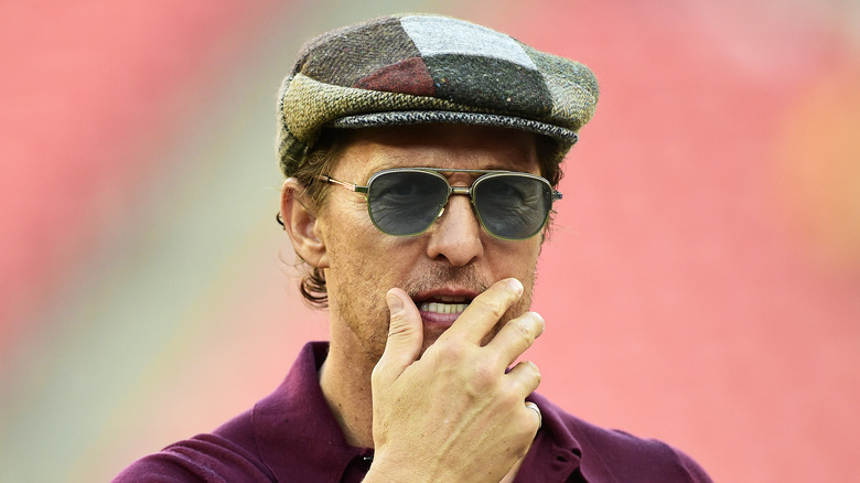 Matthew McConaughey in sunglasses and a hat