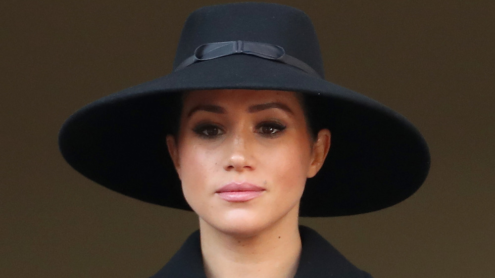 Meghan Markle in a big black hat
