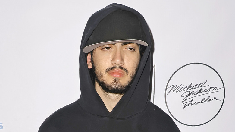 Blanket "Bigi" Jackson wearing a baseball cap