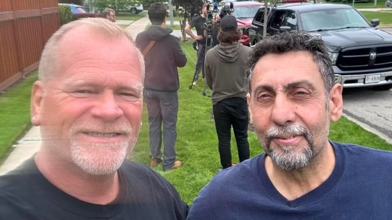 Mike Holmes smiling in selfie with Frank Cozzolino