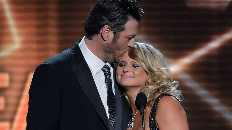 Blake Shelton kissing Miranda Lambert on head