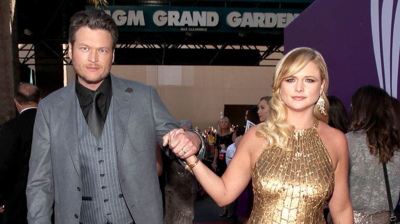 Blake Shelton and Miranda Lambert holding hands