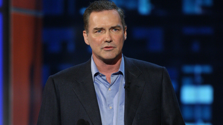 Norm Macdonald looking sad on stage