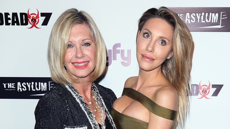Olivia Newton-John smiling with Chloe Rose Lattanzi