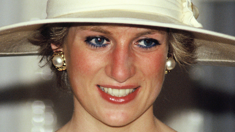 Princess Diana smiling in wide hat