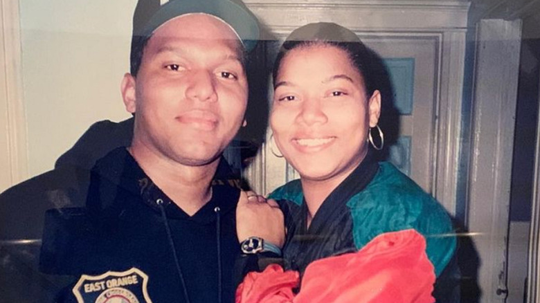 Queen Latifah and her brother smiling