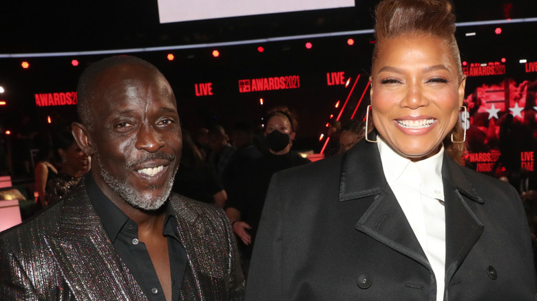 Queen Latifah and Michael K Williams laughing