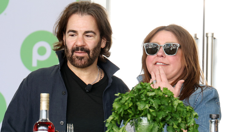John Cusimano and Rachael Ray doing a cooking demonstration.