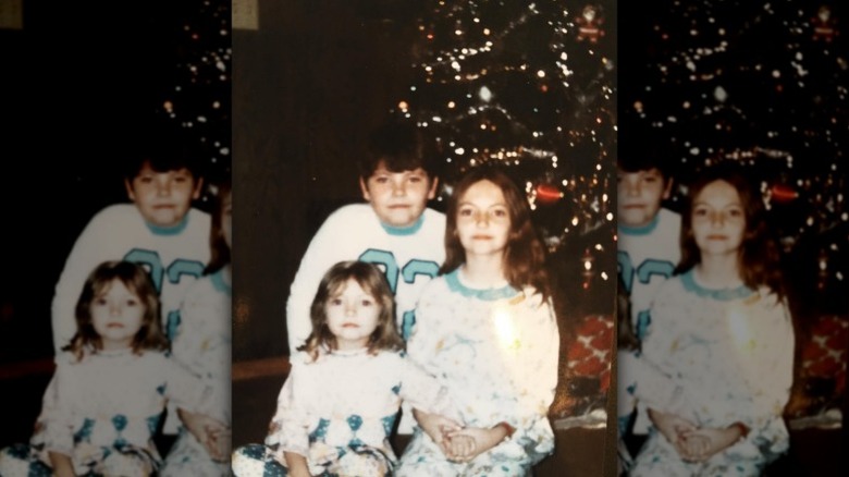 Young Rebecca Gayheart poses with her siblings
